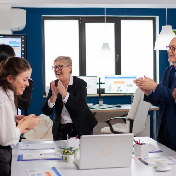 Happy diverse colleagues with new business opportunity